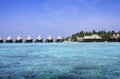 Houses over transparent quiet sea water- tropical paradise, Maldives Royalty Free Stock Photo