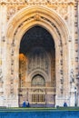 Houses of Parliament Sep 2014 in London. People walkinn in front of old church door and marble antique wall