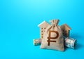 Houses and russian ruble money bag. Building up capital, saving from inflation risks. Real estate. Savings. Declaration, taxes