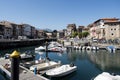 Houses and small parked boats in the port town of Llanes in Spain