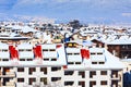 Houses with snow roofs panorama in Bansko, Bulgaria Royalty Free Stock Photo