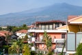 Houses on street in Giardini Naxos and Etna mount Royalty Free Stock Photo