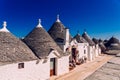 Houses of the tourist and famous Italian city of Alberobello, with its typical white walls and trulli conical roofs