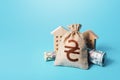 Houses and ukrainian hryvnia money bag. Building up capital, saving from inflation risks. Real estate. Declaration, taxes payment