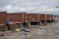 houses under construction. Brick walls on the sides