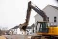 Houses under construction foundation with excavator work Royalty Free Stock Photo
