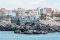 Houses on volcanic rocks on the shore of beach by the sea in tenerfie siland, Spain Royalty Free Stock Photo