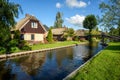 Houses on water canal in Giethoorn village, Netherlands