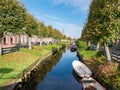 Houses with waterside gardens on Eegracht canal in IJlst, Friesland, Netherlands