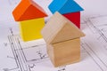 Houses of wooden blocks on construction drawing of house, building house concept Royalty Free Stock Photo