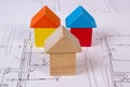 Houses of wooden blocks on construction drawing of house, building house concept Royalty Free Stock Photo