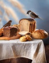 housesparrows eating from table with different types of bread, A Royalty Free Stock Photo