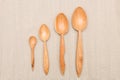 Houseware: wooden kitchen utensils, isolated on grey cotton background top view. Zero waste, eco friendly concept. Flat lay