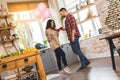 Housewarming couple. Young couple holding wine glasses in kitchen at home. Celebrating a holiday concept Royalty Free Stock Photo