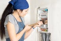 Housewife armed with a wooden mallet Royalty Free Stock Photo