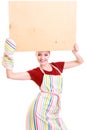 Housewife or barista in kitchen apron holds board empty blank sign isolated Royalty Free Stock Photo