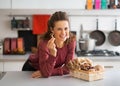 Housewife with basket with mushrooms in kitchen