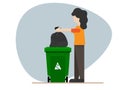 Housewife carrying a black plastic trash bag to throw it into the trash For garbage disposal Royalty Free Stock Photo