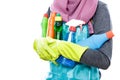 Housewife carrying many bottles of cleaning fluid