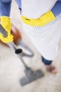 Housewife clean carpet with vacuum cleaner Royalty Free Stock Photo