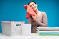 Housewife with clean linen at laundry table