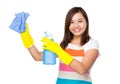 Housewife cleaning using the rag and bottle spray Royalty Free Stock Photo