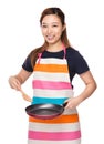 Housewife cooking with fried pan and wooden ladle Royalty Free Stock Photo