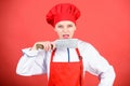 Housewife with cooking knife. butcher cut meat. woman in cook hat and apron. professional chef in kitchen. Cuisine Royalty Free Stock Photo