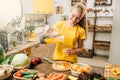 Housewife cooking orange juice, bio food