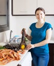 Housewife cooking sea food in home Royalty Free Stock Photo