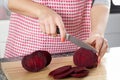Housewife cutting beetroot