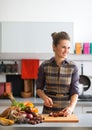 Housewife cutting cherokee purple tomato