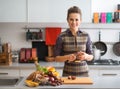 Housewife cutting cherokee purple tomato