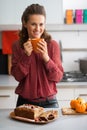 Housewife drinking tea with freshly pumpkin bread Royalty Free Stock Photo