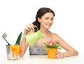 Housewife with flower in pot and watering can Royalty Free Stock Photo