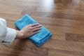 Housewife hand cleaning laminated wooden floor Royalty Free Stock Photo