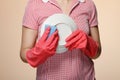 housewife hands with gloves holding scrubberr