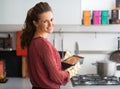 Housewife holding baking dish with bread Royalty Free Stock Photo