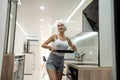 housewife with frying pan in the kitchen prerare breakfest after shower Royalty Free Stock Photo