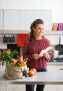 Housewife holding grocery shopping checks Royalty Free Stock Photo