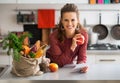 Housewife holding grocery shopping checks Royalty Free Stock Photo