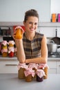 Housewife among jars with homemade fruits jam Royalty Free Stock Photo