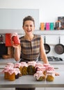 Housewife among jars with homemade fruits jam Royalty Free Stock Photo