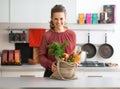 Housewife with local market purchases in kitchen Royalty Free Stock Photo