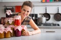 Housewife looking out from jars Royalty Free Stock Photo