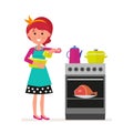 Housewife or maid with a mixer in her hands preparing food on a gas or electric stove. Pots and kettle. The meat is in