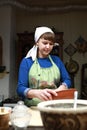 Housewife making dough in bowl