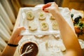 Housewife making finishing touches on vanilla pistachio cookie biscuits.Woman making a homemade dessert with an easy recipe, Royalty Free Stock Photo