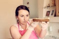 Housewife pastry chef checks the cake of the future cake for correctness