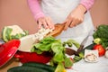 Housewife preparing cauliflower for cooking